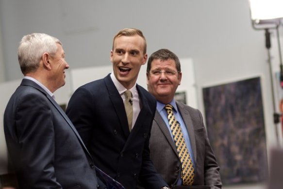 Left: Rt Hon Alan Johnson MP (a white-haired man in a grey suit); Middle: Paul Brand (short blonde hair, black suit, pale yellow/green tie); Right: Mike Hookem MEP (spectacles, short brown hair, grey suit with blue shirt and yellow/black stripy tie).